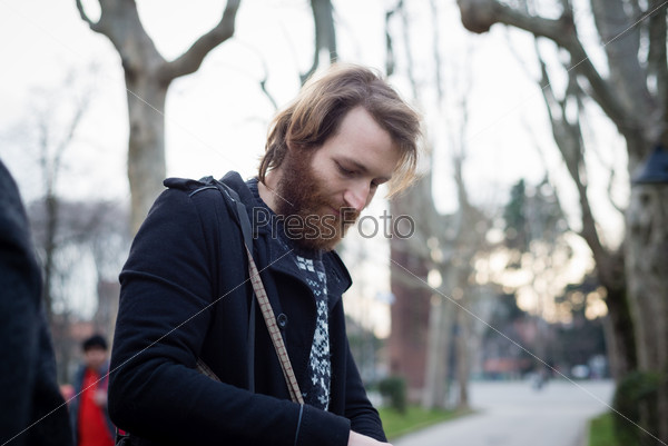 young hipster bearded man at the park