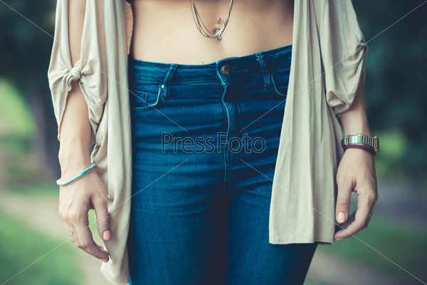 close up of belly button of young woman outdoor