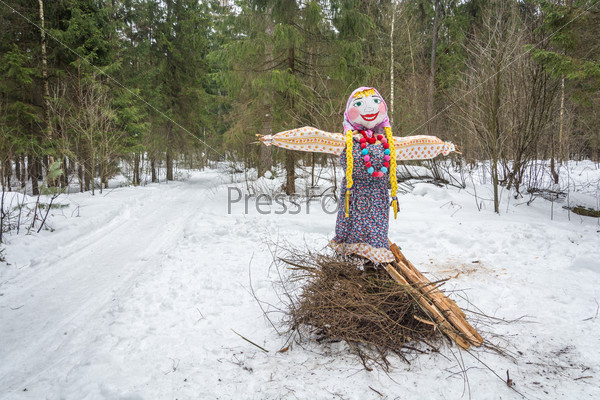 The effigy of carnival is in a forest glade. Ivanovo, Russia, February 22, 2015. On the holiday of Maslenitsa.