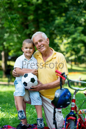 grandfather and child have fun in park