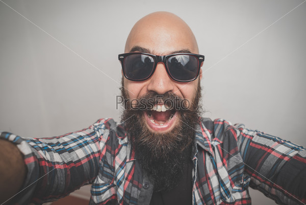 hipster long bearded and mustache man with shirt squares selfie