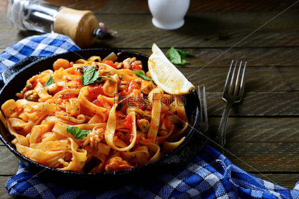 Spaghetti with seafood in a pan, mediterranean food