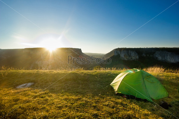 tent in the mountains at sunrise
