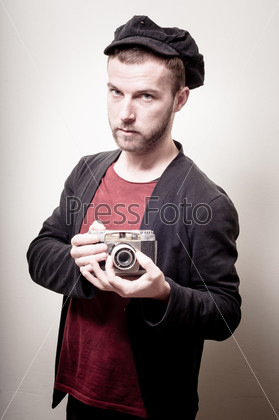 hipster stylish fashion man with old camera
