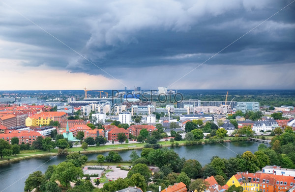 The bird\'s eye view from the Church of Our Saviour on the storm front over Copenhagen.
