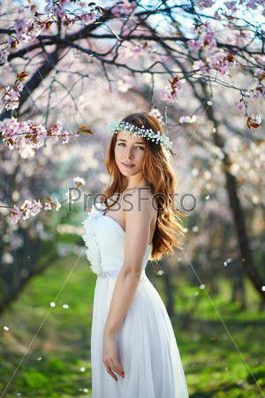 Bride with her hair in a spring garden