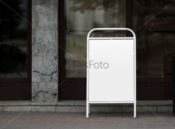 Street poster - clamshell in white painted steel frame. Clipping path. Shallow depth of field.