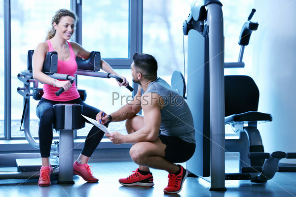woman exercising with her personal trainer