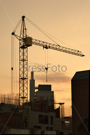 Lifting crane in evening