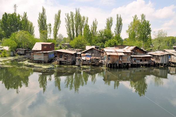 Slum houses near the river, Srinagar, India