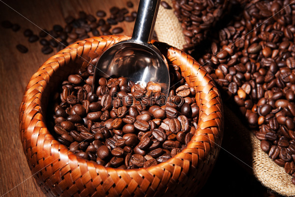 Roasted coffee beans in a bamboo basket