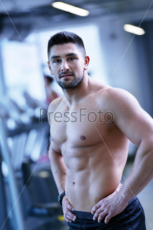handsome man exercising at the gym