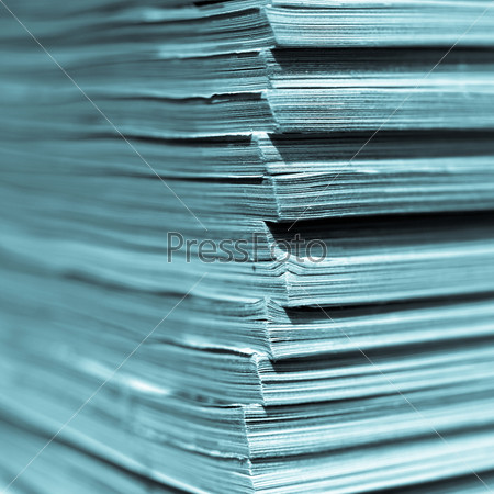 Office paper documents useful as a background - with selective focus - cool cyanotype