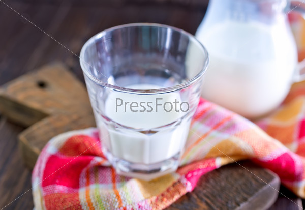 Fresh milk in glass and on a table, stock photo