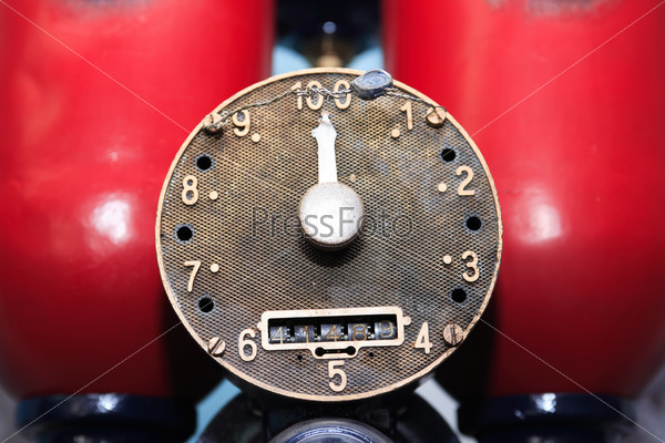 Closeup of old fuel pump dial with arrow
