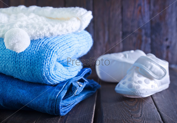 baby clothes for boy on the wooden table