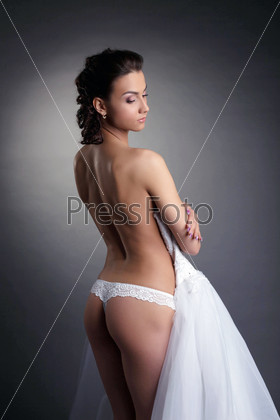 Portrait of seductive bride posing nude