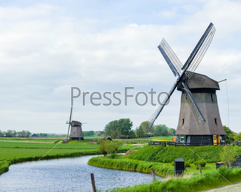 Panorama of the traditional Dutch windmill near the channel. Netherlands. Panorama