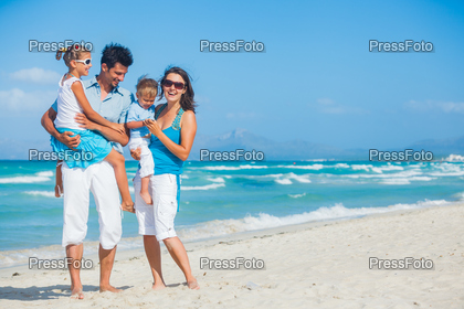 Family having fun on tropical beach