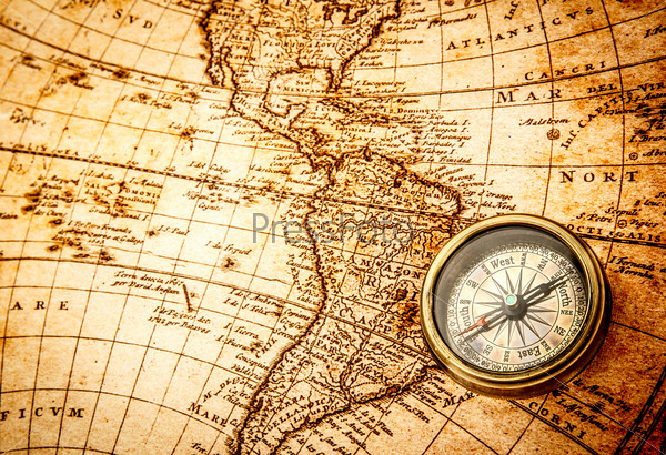 Компас на древней карте мира