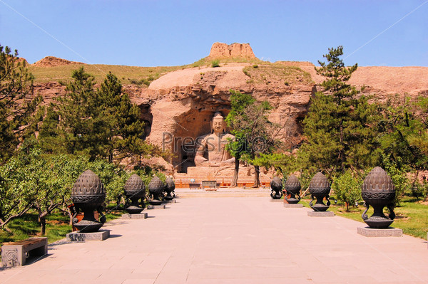 Yungang Grottoes Buddha caves is a UNESCO World cultural heritage site near Datong, Shanxi Province. It is cave 20. Buddha is 13.7 metres high.