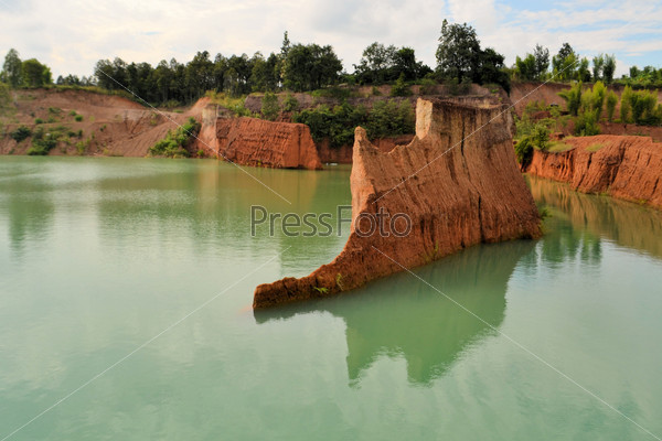 popular quarry pond for swimming and outdoor life, lake at excavation site in Opkhan national park near Chiang Mai, Thailand