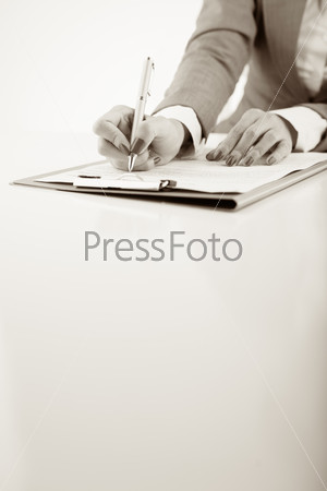 Black and white image of lawyer examining document