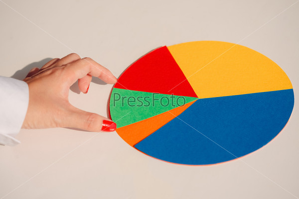 Hand touching colorful paper circle graph