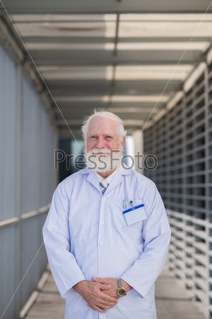 Portrait of smiling senior scientist or medical worker