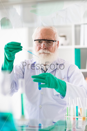 Senior medical scientific researcher filling test-tube
