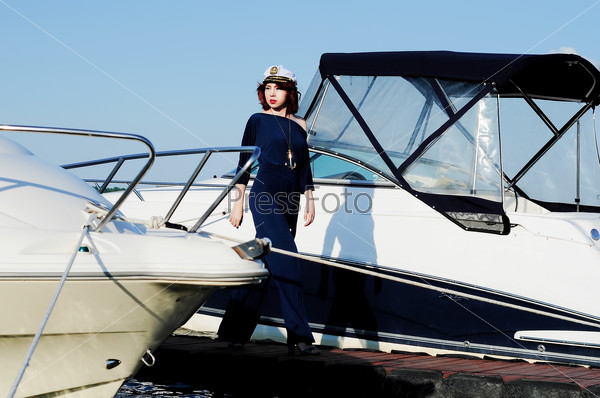 Young beautiful woman walking dock