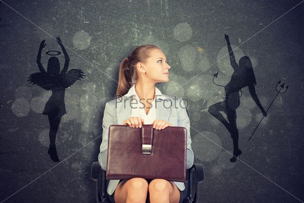 Businesswoman Framed by Shadow of Angel and Devil