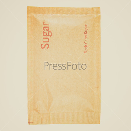 Vintage retro looking A bag of brown sugar - isolated over white background