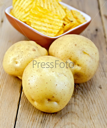 Potatoes yellow and chips on board