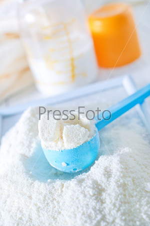 close up of powdered milk and spoon for baby