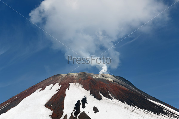 Avacha Volcano - active volcano of Kamchatka Peninsula. View of top of volcanic cone, fumarolic activity of volcano: steam and gas emissions from crater. Russia, Far East.