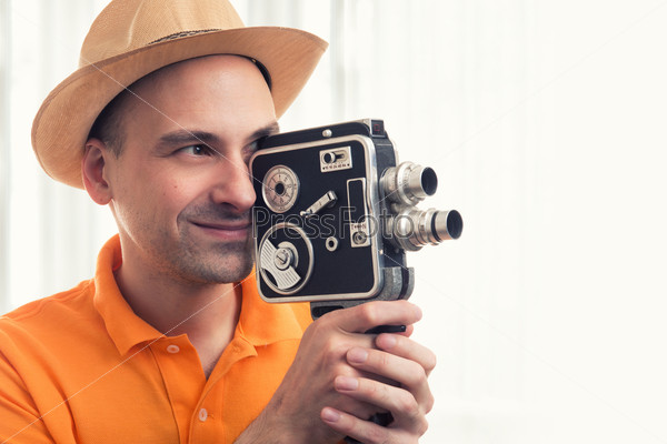 cameraman make film on a retro camera