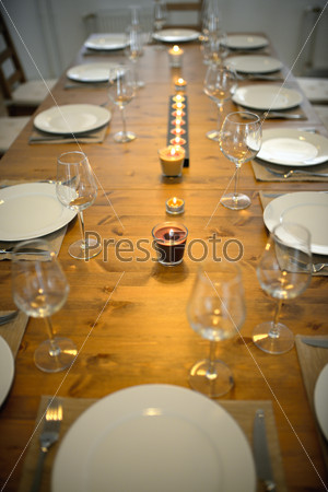 Covered dining table with wine glasses