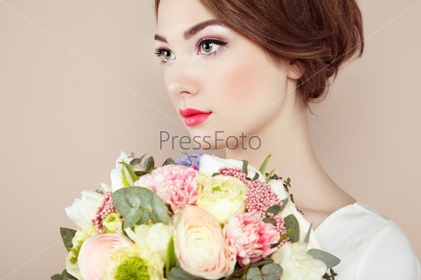 Woman with bouquet of flowers in her hands