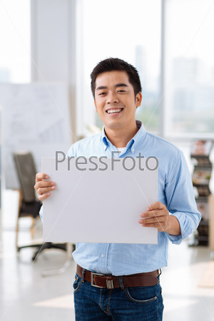Handsome Vietnamese businessman showing blank placard
