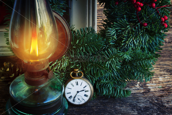 vintage glowing  lantern with evergreen christmas green wreath, low key