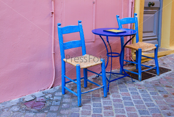 cosy street with colorful chairs, Chania old town, Crete, Greece