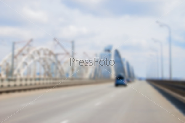 Blurred car driving to the horizon on bridge, stock photo