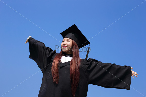 happy graduate student girl hug future and feel carefree look up to copy space, she wear graduation cap and gown ,asian