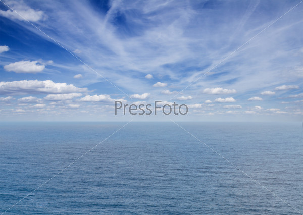 beautiful seascape with deep  blue ocean  waters and clouds