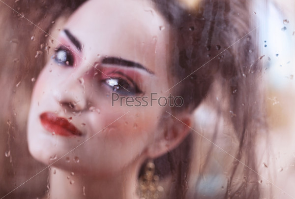 Close up stylized portrait of a Japanese geisha with bright make