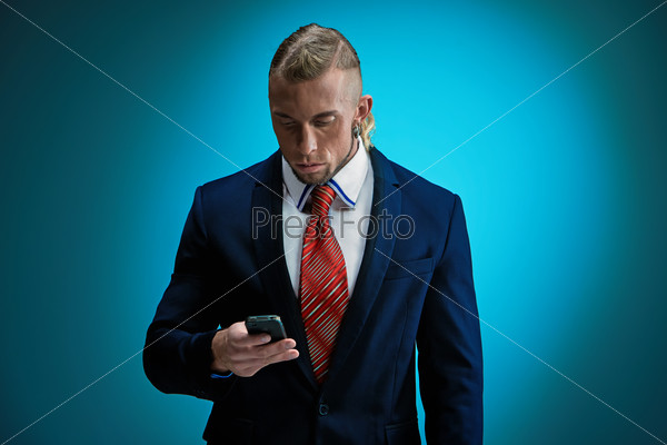 Portrait of an attractive young businessman wearing black suit