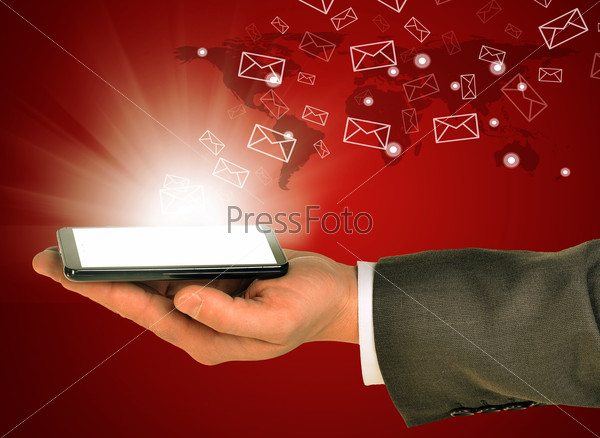 Business man holding mobile phone within left hand. Sending and getting emails. Abstract world on background