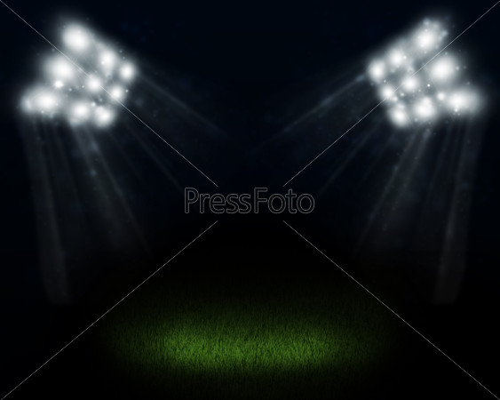 Dark empty stadium with bright spot in center