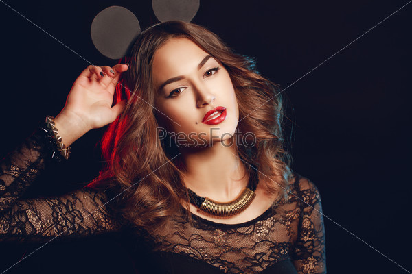 Beautiful brunette model in expensive lace lingerie. A woman dressed as a fashion cartoon mouse with big ears. Fashion art photo. Emotional female portrait.